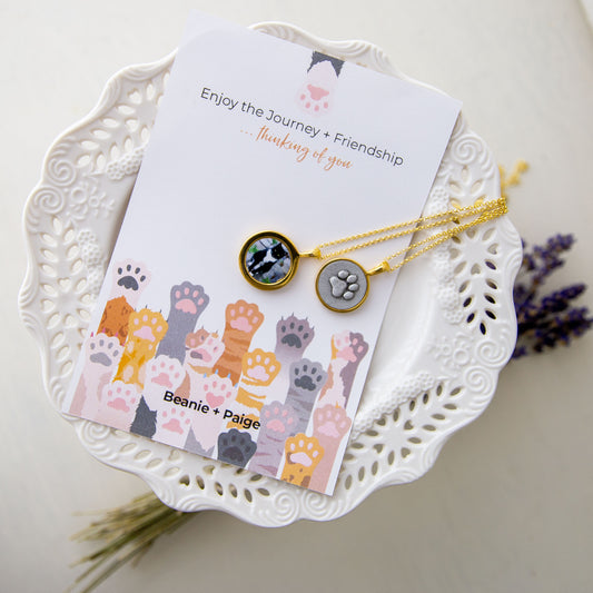 Cat Paw Print Necklace in gold on printed card "thinking of you"
