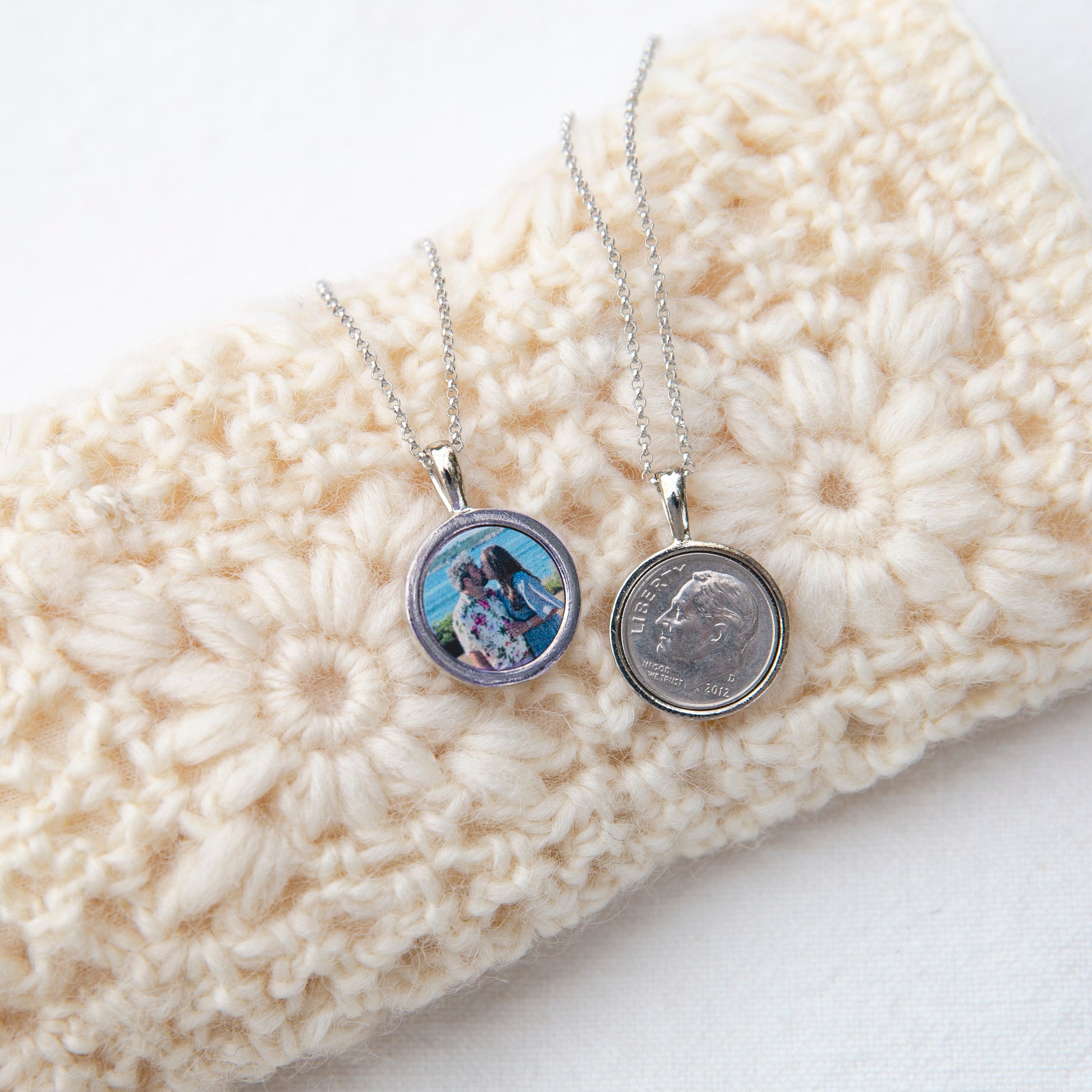 Displaying the front and back of the Divine Dime necklace. It features a dime on the front and a personalized photo.