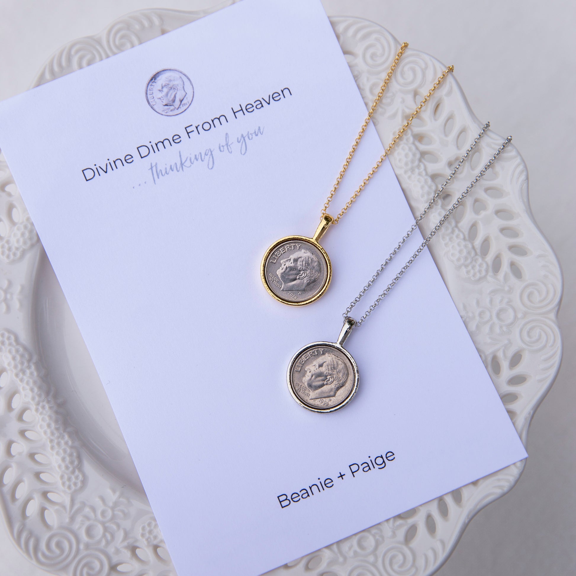 The picture is of our divine dime gold and the silver version necklaces on top of the essence card they come with.